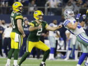 Green Bay Packers kicker Mason Crosby (2) watches his 51-yard field goal to win the game as time expires during the second half of an NFL divisional playoff football game against the Dallas Cowboys Sunday, Jan. 15, 2017, in Arlington, Texas. The Packers won 34-31.