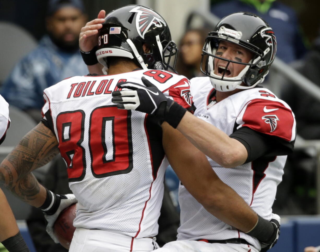 Atlanta Falcons quarterback Matt Ryan (2) celebrates with tight end Levine Toilolo (80). Ryan, edging New England's Tom Brady, who was suspended for four games, was selected to The Associated Press 2016 NFL All-Pro Team for the first-time, Friday, Jan. 6, 2016.