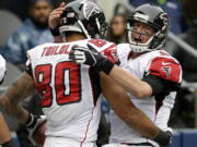 Atlanta Falcons quarterback Matt Ryan (2) celebrates with tight end Levine Toilolo (80). Ryan, edging New England's Tom Brady, who was suspended for four games, was selected to The Associated Press 2016 NFL All-Pro Team for the first-time, Friday, Jan. 6, 2016.