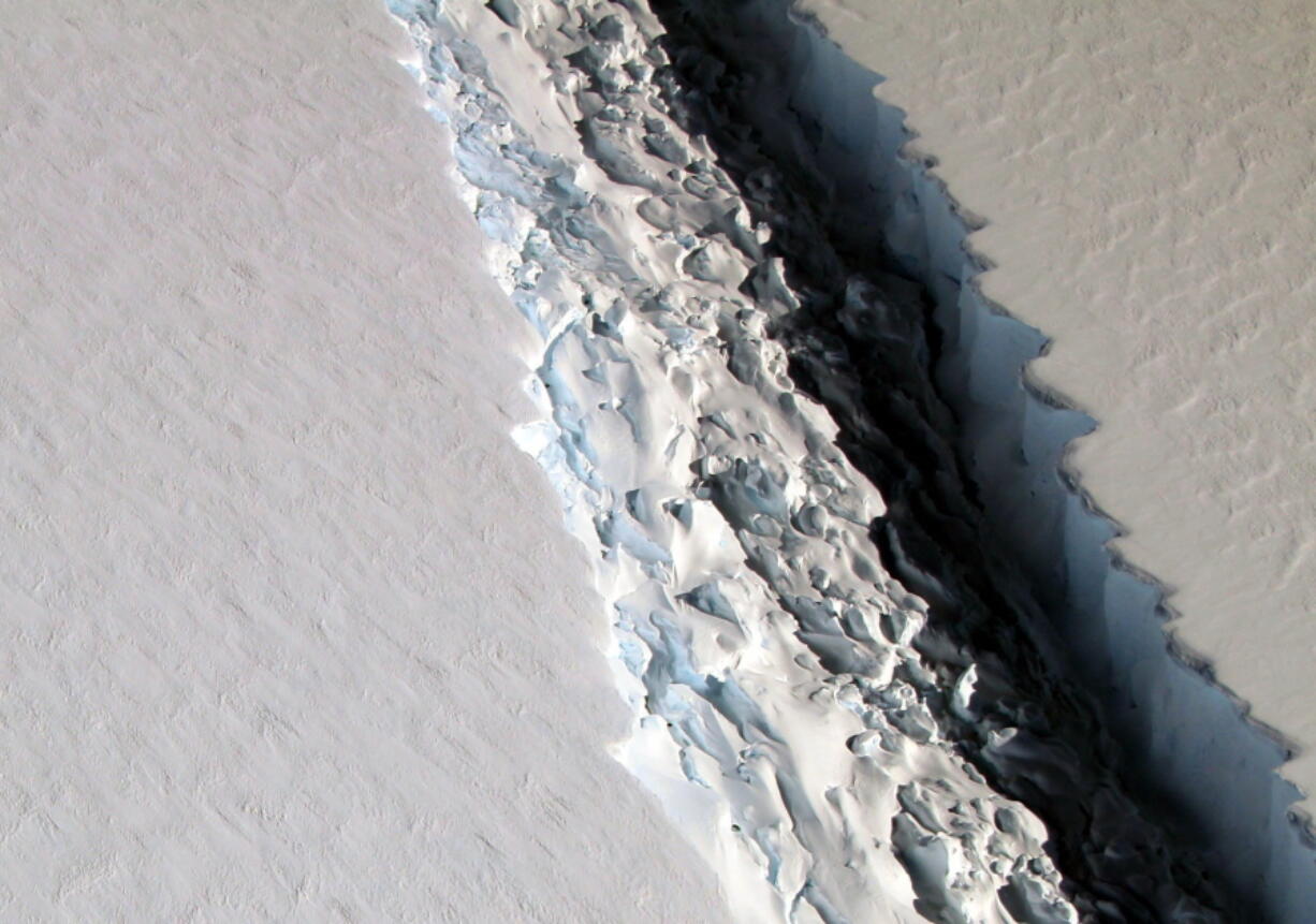 This Nov. 10, 2016 aerial photo released by NASA shows a rift in the Antarctic Peninsula&#039;s Larsen C ice shelf. According to NASA, IceBridge scientists measured the Larsen C fracture to be about 70 miles long, more than 300 feet wide and about a third of a mile deep.