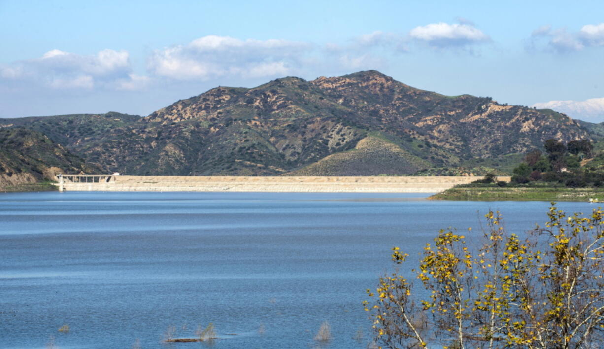 This photo from Wednesday shows a view of Irvine Lake in Silverado, Calif., looking toward the dam. Recent storms have brought much-needed water to Orange County lake and reservoirs.