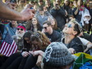 Milo Yiannopoulos, right, is sprayed with Silly String along with UC Davis College Republicans as they re-enact the Nov. 18, 2011, pepper-spraying of students by campus police during a rally on campus Saturday.