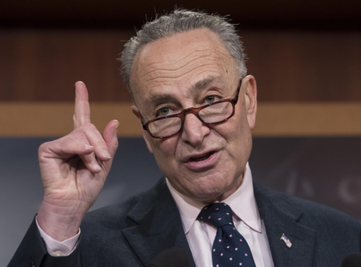 Senate Minority Leader Charles Schumer, D-N.Y., accompanied by other Senate Democrats, speaks during a news conference on Capitol Hill in Washington on Jan. 24 to offer a proposal to spend $1 trillion on transportation and other infrastructure projects over 10 years in an attempt to engage President Donald Trump on an issue where they hope to find common ground. (AP Photo/J.