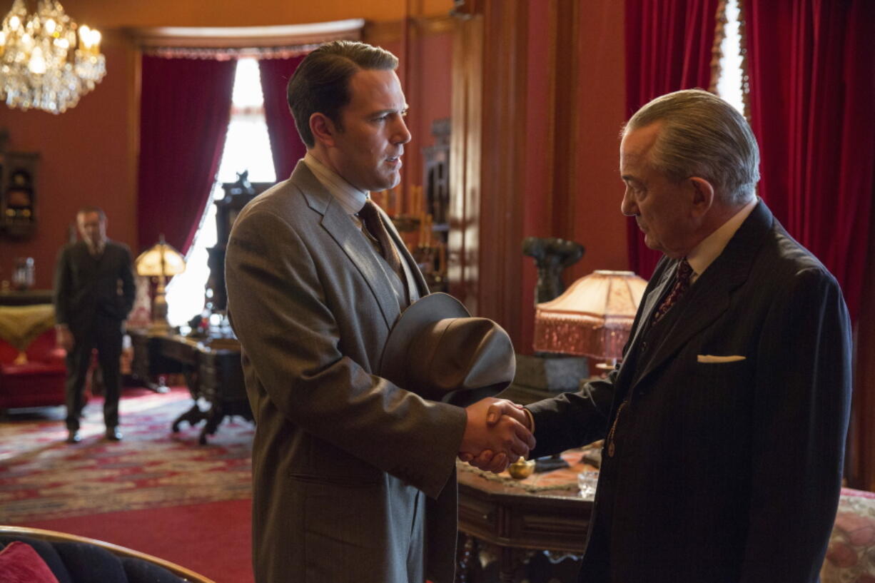 Ben Affleck, left, and Remo Girone appear in a scene from &quot;Live by Night.&quot; (Claire Folger/Warner Bros.