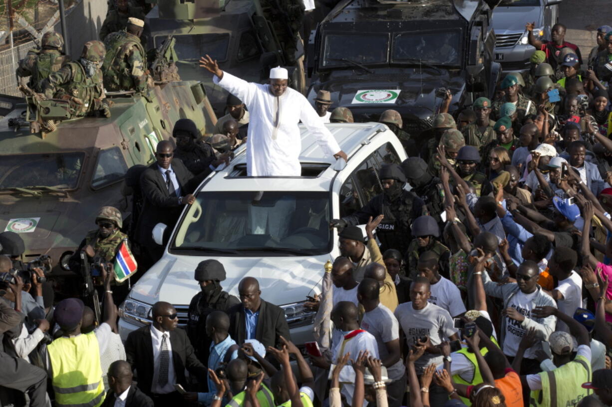 Gambian President Adama Barrow greets the crowds after arriving at Banjul airport in Gambia, Thursday Jan. 26, 2017, after flying in from Dakar, Senegal. Gambia&#039;s new president has finally arrived in the country, a week after taking the oath of office abroad amid a whirlwind political crisis. Here&#039;s a look at the tumble of events that led to Adama Barrow&#039;s return ??? and the exile of the country&#039;s longtime leader.