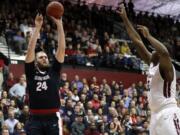 Gonzaga center Przemek Karnowski (24) shoots over Santa Clara center Tony Lewis during the second half of an NCAA college basketball game Thursday, Jan. 19, 2017, in Santa Clara, Calif.