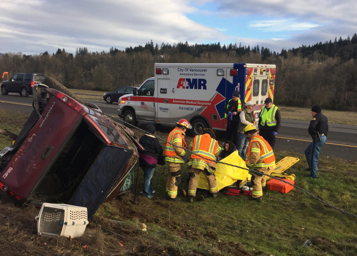 Emergency crews work Monday morning to help the driver of a pickup truck who was hurt when her vehicle was rear-ended by a suspected impaired driver on Interstate 5 in Woodland. The pickup’s driver, a Battle Ground woman, was treated and released Monday from a local hospital.