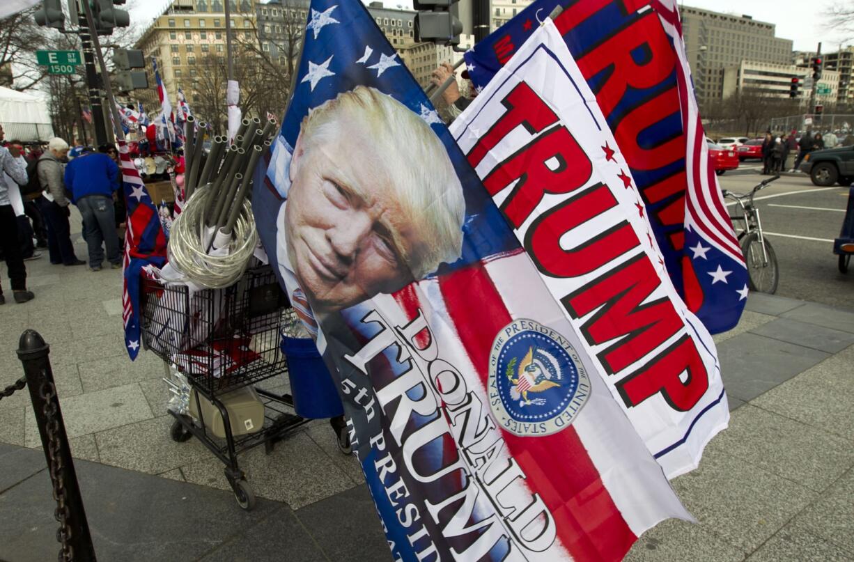 Flags with the image of President-elect Donald Trump are displayed for sale in Pennsylvania Avenue in Washington on Thursday ahead of Friday's inauguration.