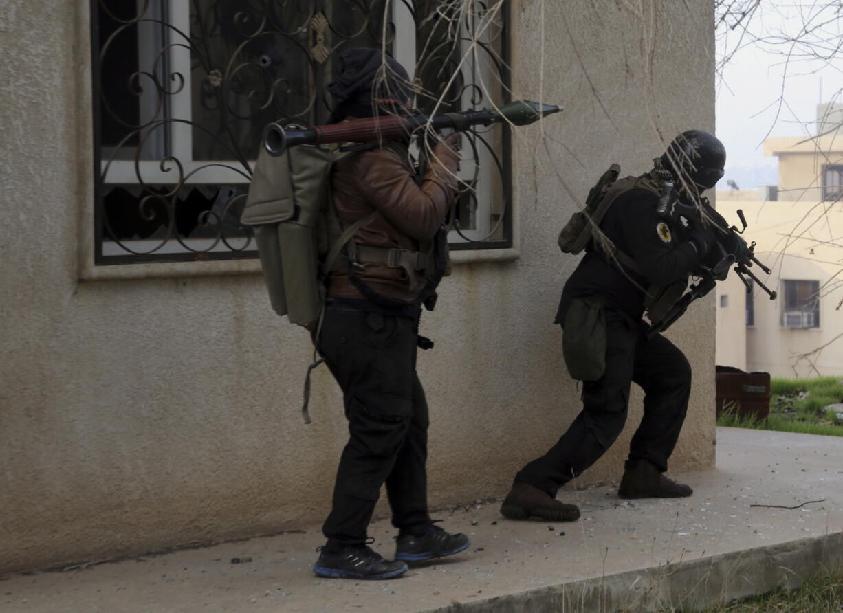 Iraqi special forces fight against Islamic State militants to regain control of Mosul University, in the eastern side of Mosul, Iraq, Saturday, Jan. 14, 2017.