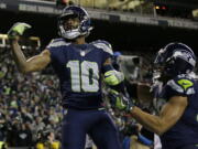 Seahawks receiver Paul Richardson (10) celebrates with Doug Baldwin after Richardson caught a pass for a touchdown during Seattle&#039;s win over the Lions.