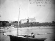 Penobscot Bay fishermen clean mackerel near their saltwater farm off the Maine coast in 1891.