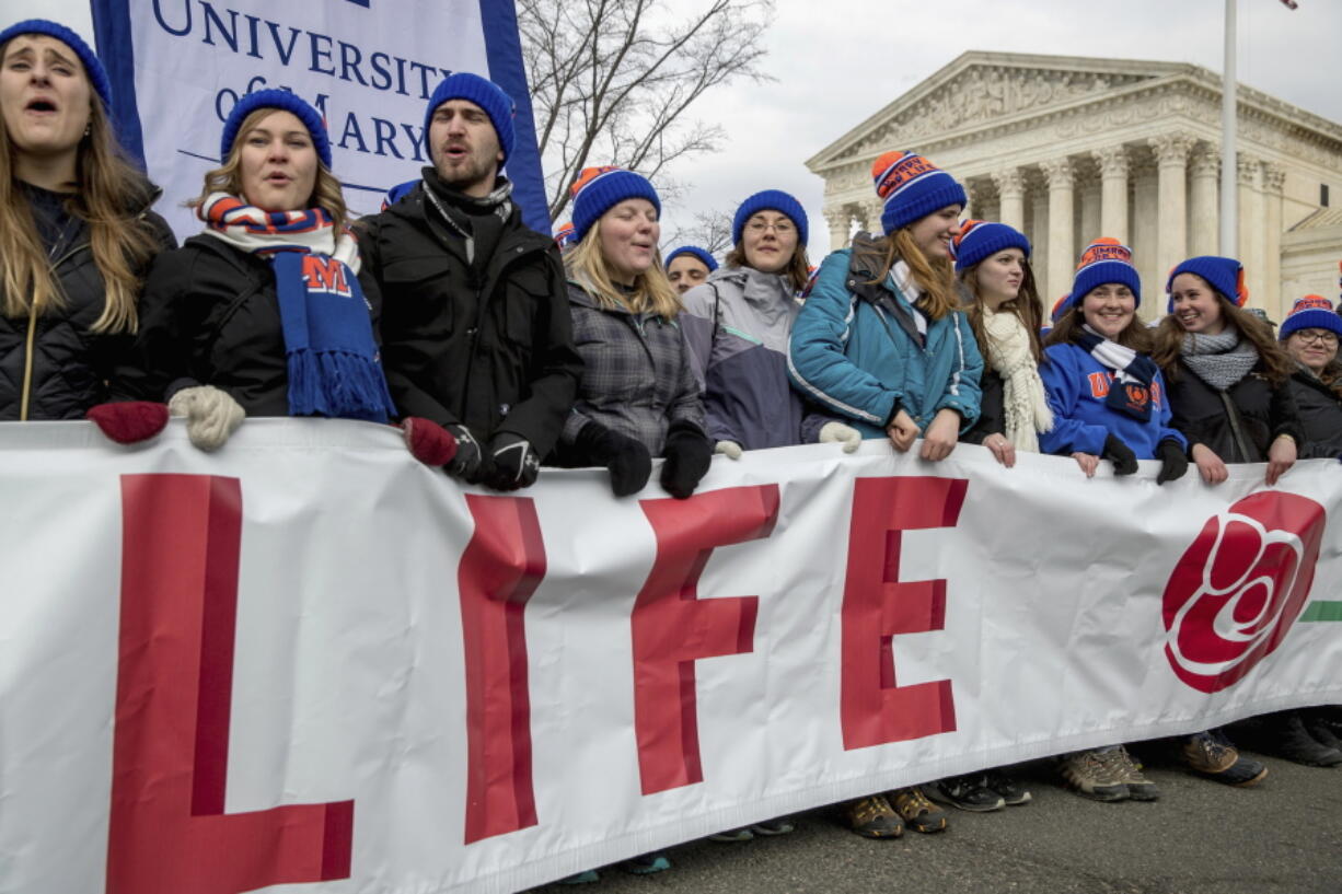 Anti-abortion activists march past the Supreme Court in Washington, Friday, Jan. 27, 2017, during the annual March for Life. Thousands of anti-abortion demonstrators gathered in Washington for an annual march to protest the Supreme Court&#039;s landmark 1973 decision that declared a constitutional right to abortion. (AP Photo/Andrew Harnik) (J.