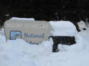 The Mount St. Helens National Volcanic Monument sign on road No. 83 on the south side of the mountain is seen earlier this month.