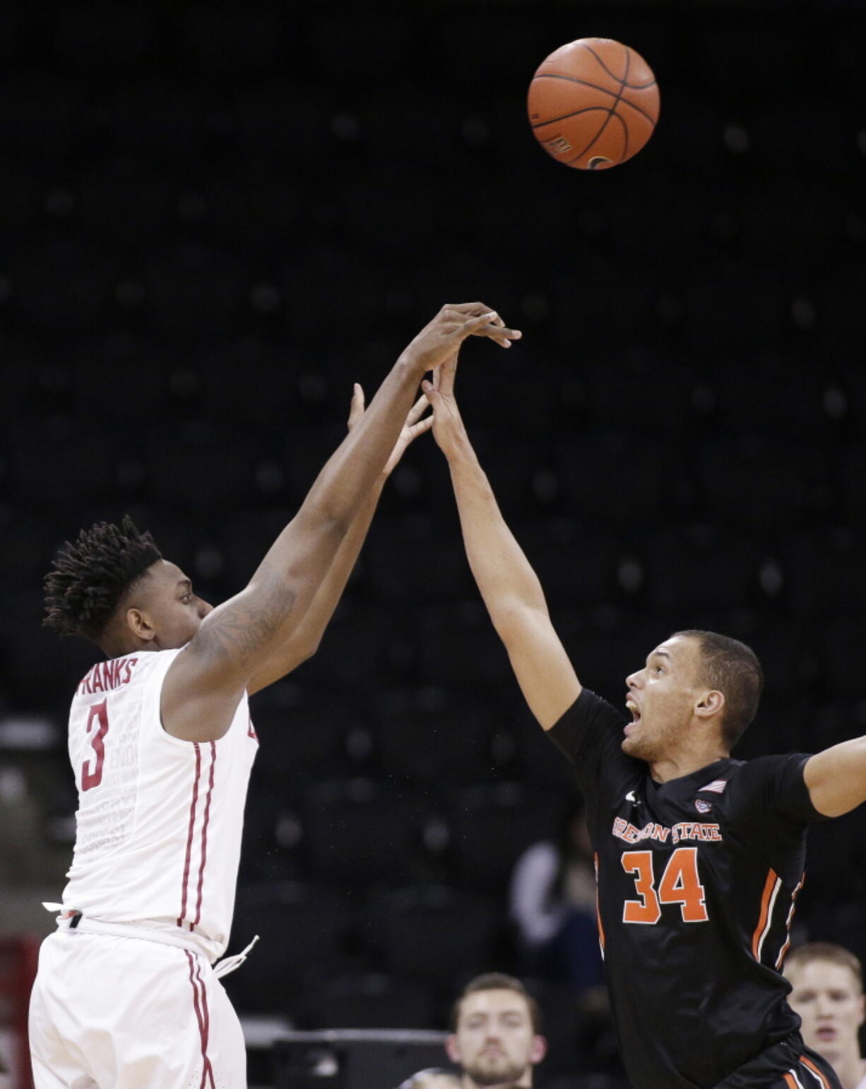 Washington State forward Robert Franks (3) shoots while defended by Oregon State forward Ben Kone (34) during the first half of an NCAA college basketball game in Spokane, Wash., Wednesday, Jan. 4, 2017.