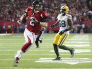 Atlanta Falcons&#039; Matt Ryan runs for a touchdown during the first half of the NFL football NFC championship game against the Green Bay Packers, Sunday, Jan. 22, 2017, in Atlanta.