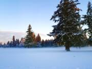 Fog shrouds the snow at a playing field east of McLoughlin Middle School.