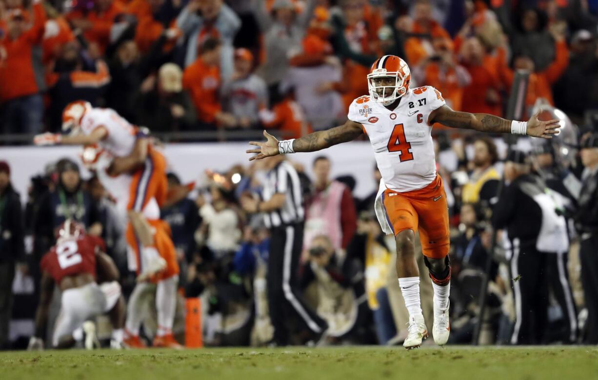 Clemson's Deshaun Watson celebrates a last second touchdown pass to Hunter Renfrow during the second half of the NCAA college football playoff championship game against Alabama Tuesday, Jan. 10, 2017, in Tampa, Fla.