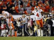 Clemson's Deshaun Watson celebrates a last second touchdown pass to Hunter Renfrow during the second half of the NCAA college football playoff championship game against Alabama Tuesday, Jan. 10, 2017, in Tampa, Fla.