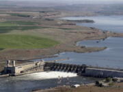 The Ice Harbor Dam on the Snake River is seen near Pasco. Environmental groups are asking a federal court to halt 11 infrastructure projects on four lower Snake River dams in Washington state that could ultimately be removed following an environmental review now underway. The notice filed late Monday, Jan. 9, in Portland, Oregon, estimates the cost of the projects at $110 million.