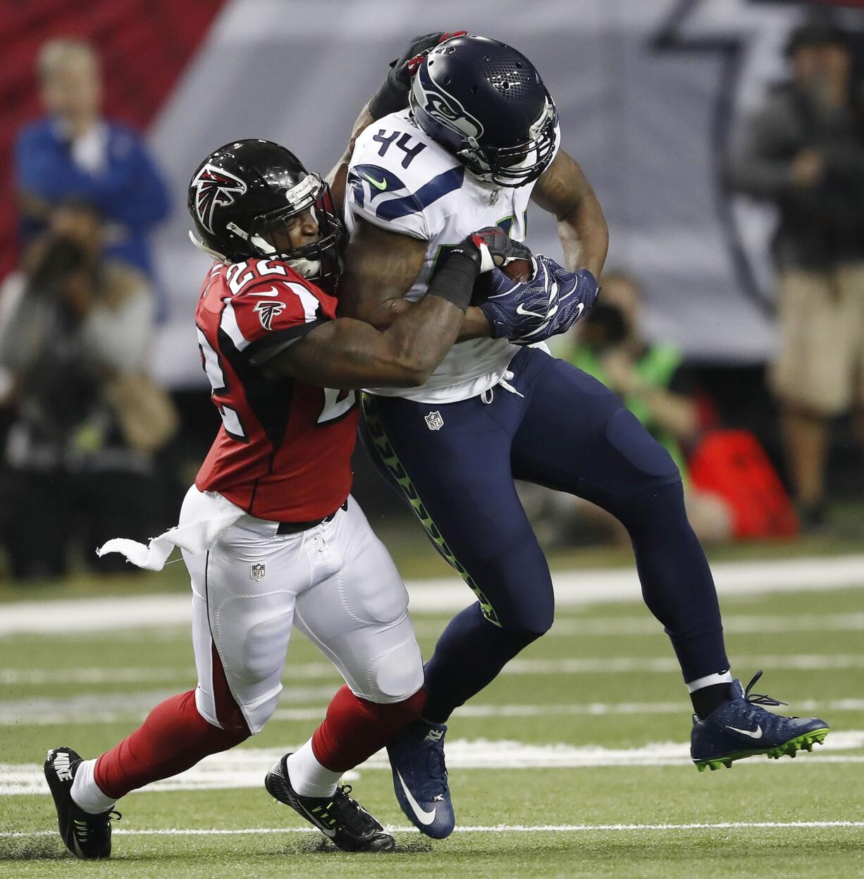 Seattle Seahawks fullback Marcel Reece (44) runs against Atlanta Falcons strong safety Keanu Neal (22) during the first half of an NFL football NFC divisional playoff game, Saturday, Jan. 14, 2017, in Atlanta.