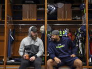 Seattle Seahawks offensive linemen Justin Britt, left, and Garry Gilliam talk as players clean out their lockers in Renton on Sunday.