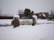 Snow blankets the front of Wy'East Middle School as school was closed to students around Clark County due to the weather Wednesday morning, Jan. 11, 2017.