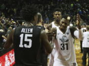 Stanford&#039;s Marcus Allen meets Oregon&#039;s Jordan Bell and Dylan Ennis, right, on the court after their NCAA college basketball game, Saturday, Jan. 21, 2017, in Eugene, Ore. Oregon defeated Stanford 69-52.