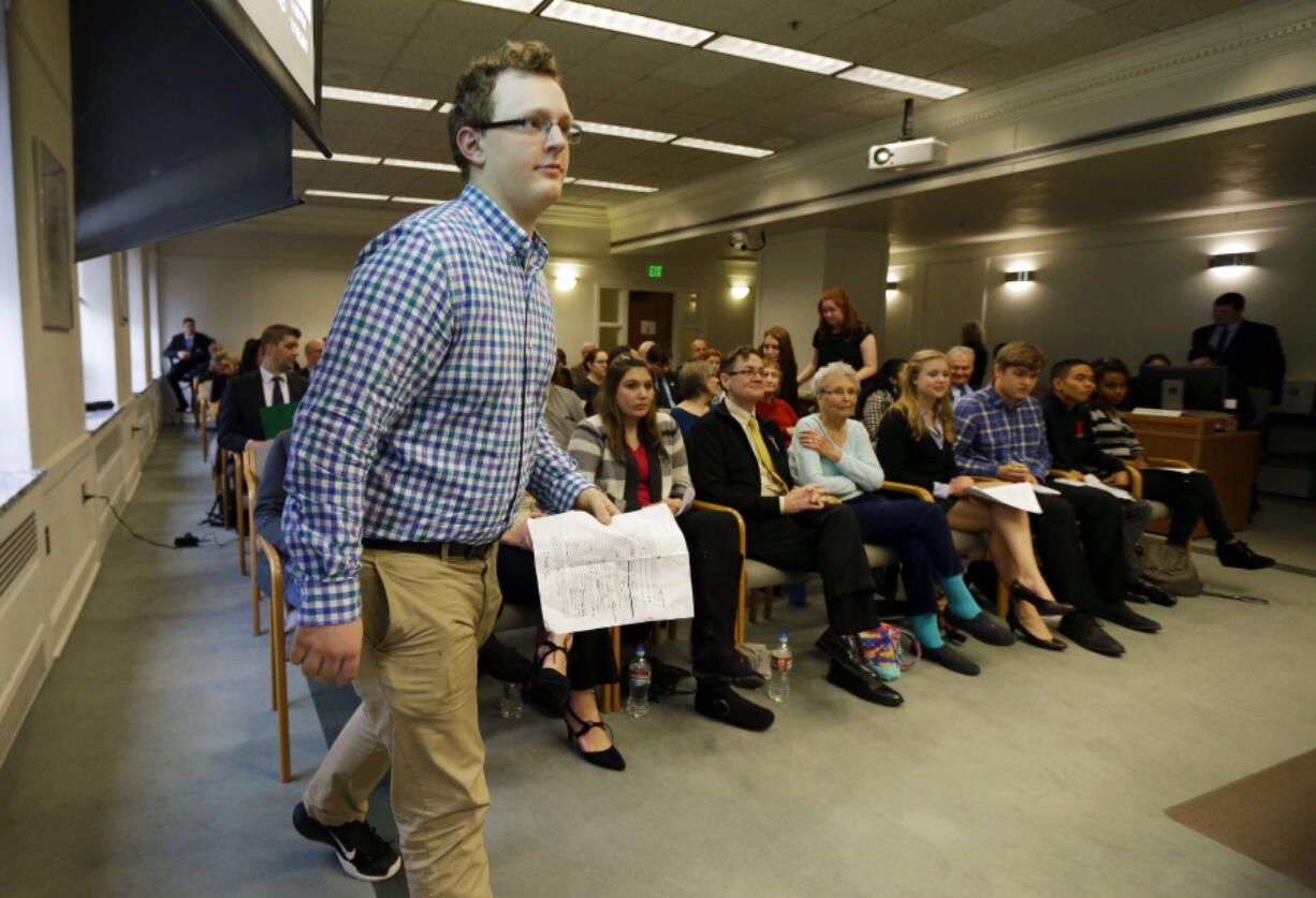 Jaxon Owens, 17, left, editor-in-chief of the Viking Vanguard student newspaper at Puyallup High School, walks to speak during a Senate hearing, Thursday, Jan. 19, 2017, at the Capitol in Olympia, Wash. Washington state lawmakers are reintroducing a bill that would protect student journalists&#039; free speech in school-sponsored media at public schools and colleges in response to a 1988 U.S. Supreme Court ruling that gave administrators control over what gets published in school media. Owens spoke in favor of the measure. (AP Photo/Ted S. Warren) (Ted S.