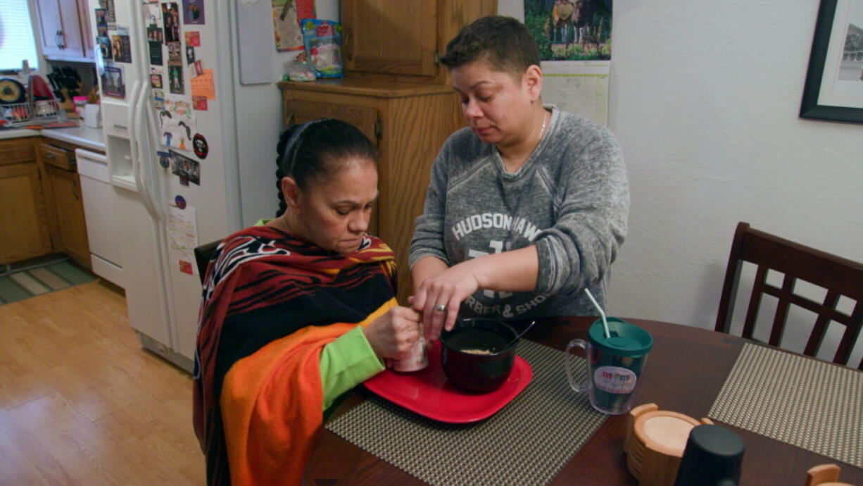 Daisy Duarte, right, cares for her mother Sonia, who was diagnosed with a genetic form of early-onset Alzheimer&#039;s, in a scene from the PBS documentary, &quot;Alzheimer&#039;s: Every Minute Counts.&quot; It originally aired on Jan. 25.