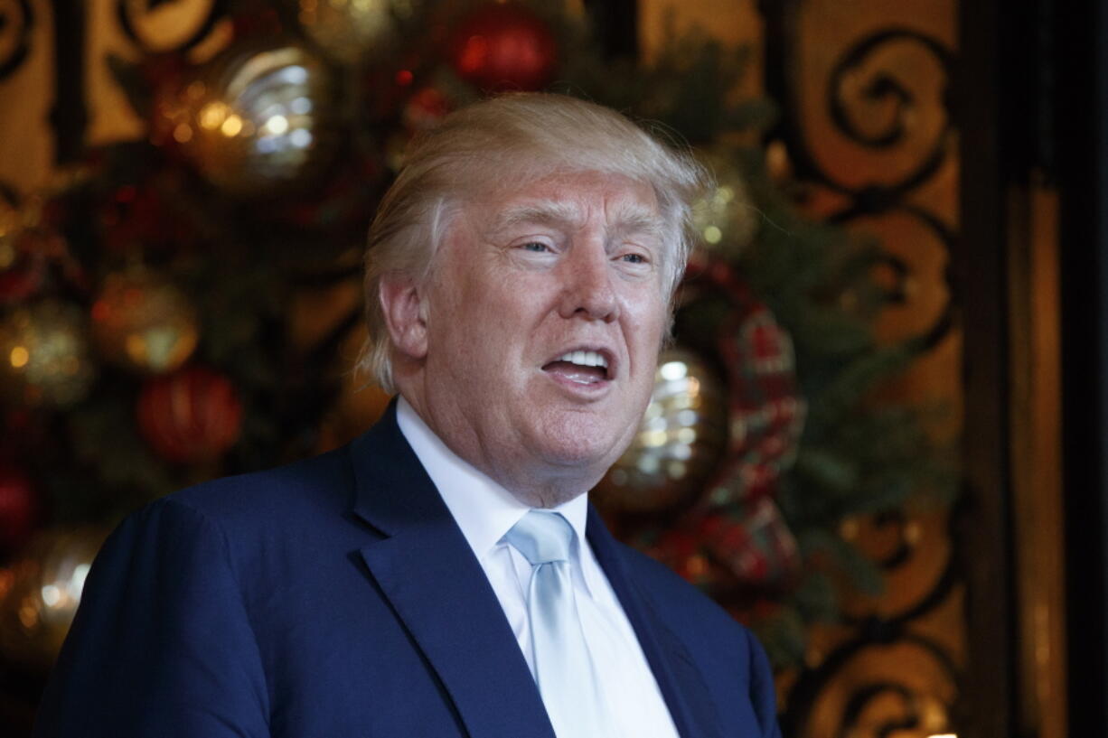 President-elect Donald Trump speaks to reporters at Mar-a-Lago in Palm Beach, Fla. Trump is considering plans to restructure and slim down a top U.S. intelligence agency, a person familiar with the discussions said Thursday. The move comes after Trump questioned the intelligence community???s assessment that Russia interfered with the presidential election on his behalf.