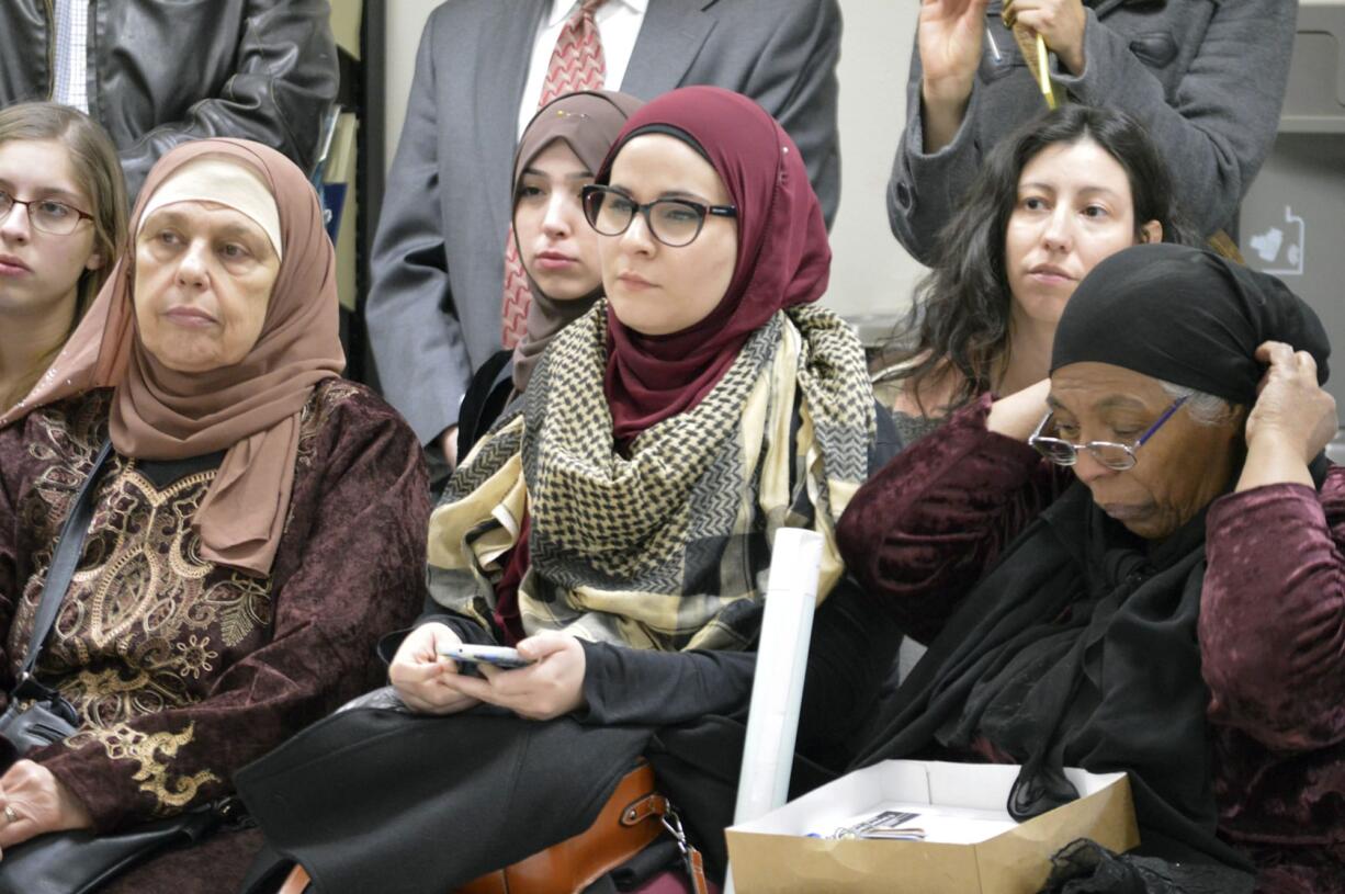 Muslim women attend a news conference at the Islamic Center of New Mexico in Albuquerque on Friday, Jan. 27, 2017, where activists denounced President Donald Trump on his executive action. Trump Wednesday signed an executive action implementing "new vetting measures" that he says are aimed at keeping "radical Islamic terrorists" out of the United States.