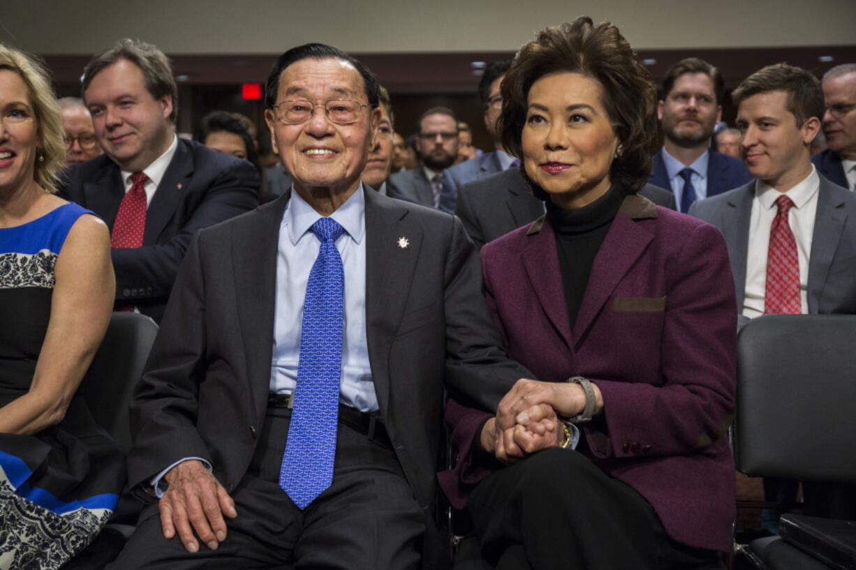 Transportation Secretary-designate Elaine Chao sits with her father James Chao on Capitol Hill in Washington on Wednesday prior to testifying at her confirmation hearing before the Senate Commerce, Science, and Transportation Committee.