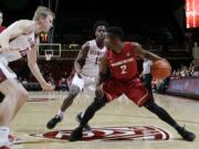 Washington State guard Ike Iroegbu (2) is defended by Stanford's Marcus Allen (15) and Michael Humphrey, left, during the first half of an NCAA college basketball game Thursday, Jan. 12, 2017, in Stanford, Calif.