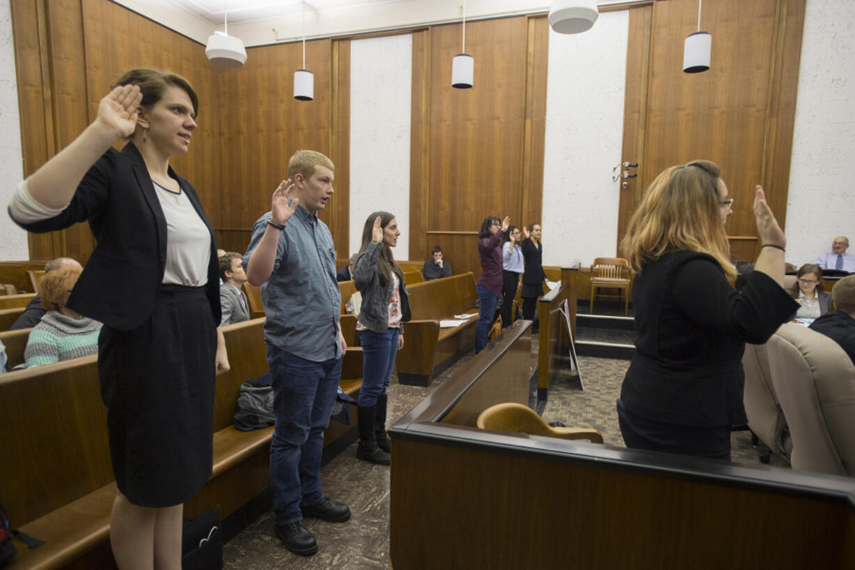 Witnesses are sworn in Feb. 16 before testifying during the mock trial at the Clark County Courthouse, where eight teams from six local schools competed for a chance to go to the state competition. The top three teams came from Camas High School, Cascadia Tech and Columbia High School.