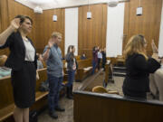 Witnesses are sworn in Feb. 16 before testifying during the mock trial at the Clark County Courthouse, where eight teams from six local schools competed for a chance to go to the state competition. The top three teams came from Camas High School, Cascadia Tech and Columbia High School.