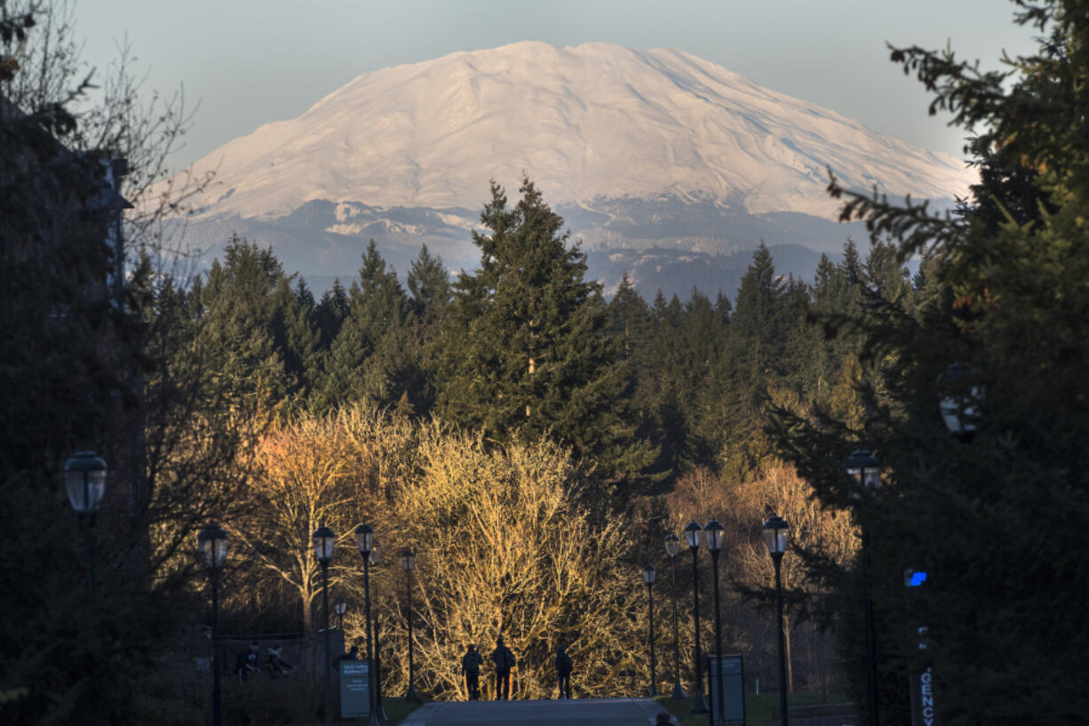 Students have a clear view of Mount St. Helens as they walk through the Washington State University Vancouver campus in January.