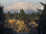 Students have a clear view of Mount St. Helens as they walk through the Washington State University Vancouver campus in January.