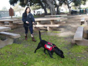 Patsy works with her service dog, Andromeda.