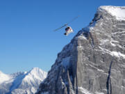 A helicopter operated by pioneer CMH Heli-Skiing hugs a powdery peak in British Columbia.MUST CREDIT: Photo for The Washington Post by Rachel Walker (Photos by Rachel Walker for The Washington Post)