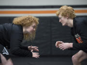 Senior Abby Lees, 17, left, and her brother, junior Tanner Lees, 16, are pictured in the wrestling room at Washougal High School on Wednesday afternoon, Feb. 15, 2017.