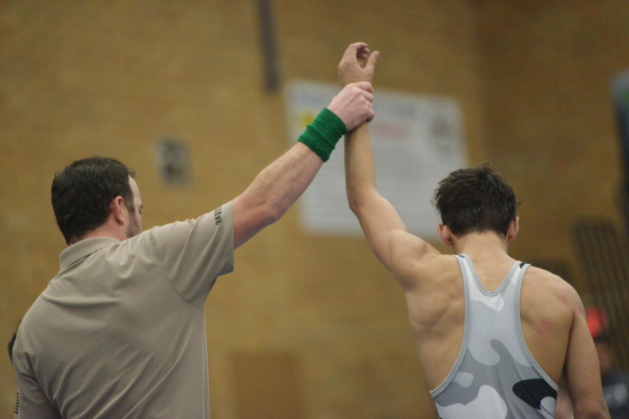 Union&#039;s Ethan Rotondo is declared the winner of the 113-pound weight class after beating Burlington Edison&#039;s Isaac Lopez during the Pac-Coast wrestling tournament at Mountain View High School on Friday, December 30, 2016.