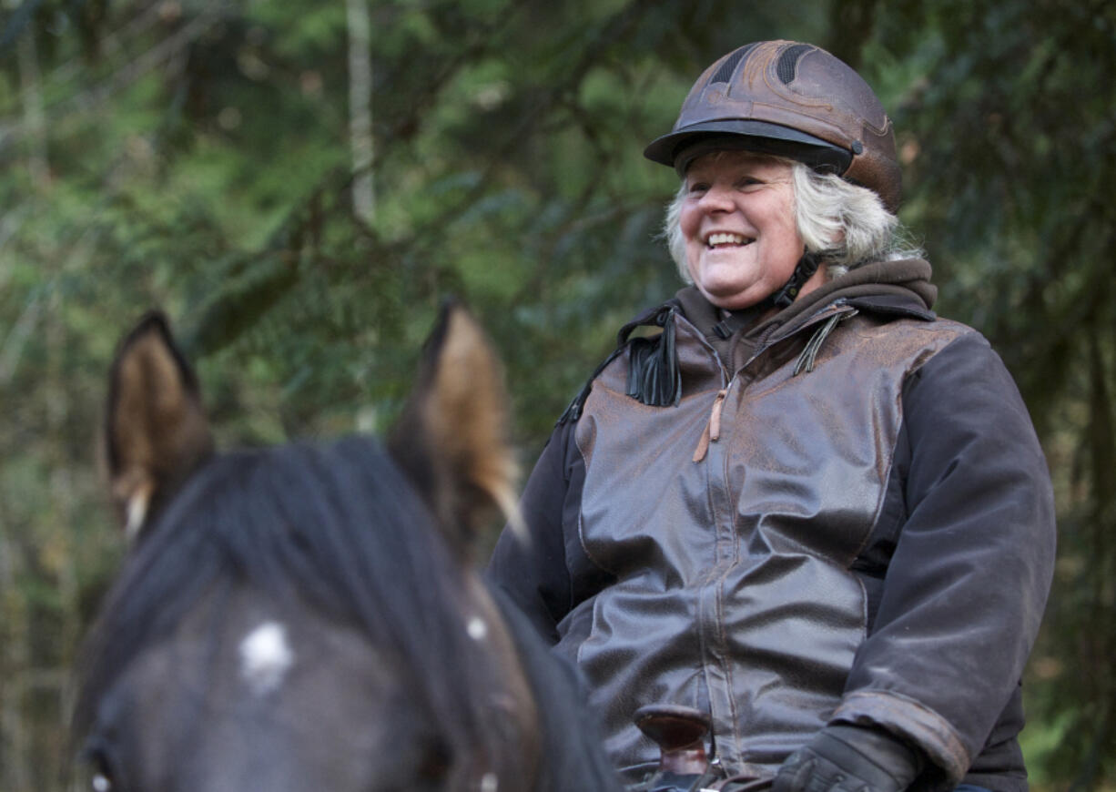 Whipple Creek Park Restoration Committee President Anita Will, on her horse Russell, shows some of the finished work and some of the work in progress at the park in 2014.