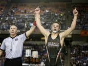 Battle Ground's James Rogers has his hands raised as a champion after taking out Curtis' Ketner Fields during their 4A 160 lb. State Wrestling championship match Saturday, Feb. 18, 2017, in Tacoma.