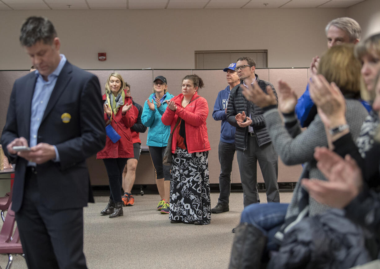 Bond supporters applaud as Vancouver Public Schools Superintendent Steve Webb thanks them for their work Tuesday evening. Vancouver&#039;s bond measure was short of validation, but more votes will be counted today.