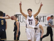 Matt Garrison of King's Way (23) celebrates the win over Forks with teammates after the game at King's Way High School on Monday night, Feb. 13, 2017.