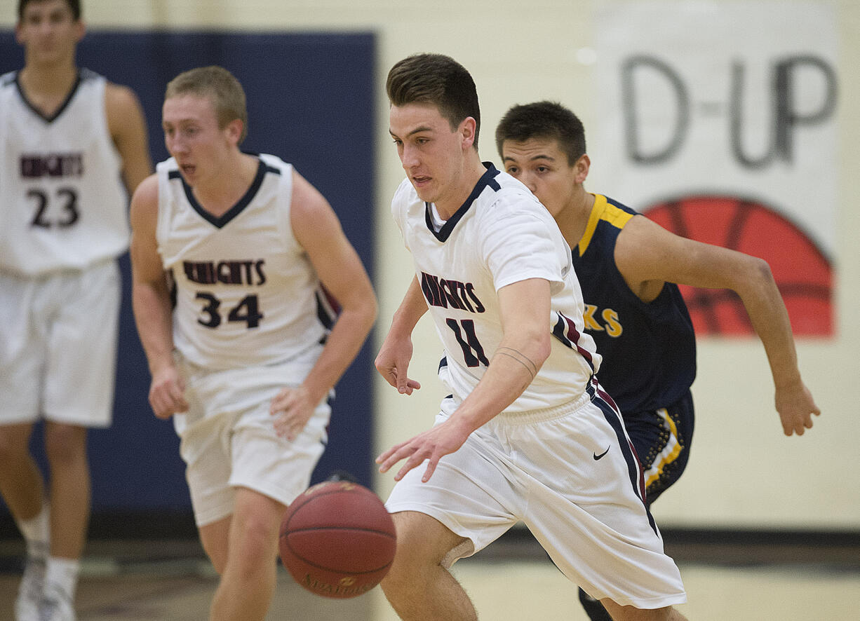 Karter Graves of King's Way (11) leads a fast break in the first quarter at King's Way High School on Monday night, Feb. 13, 2017.