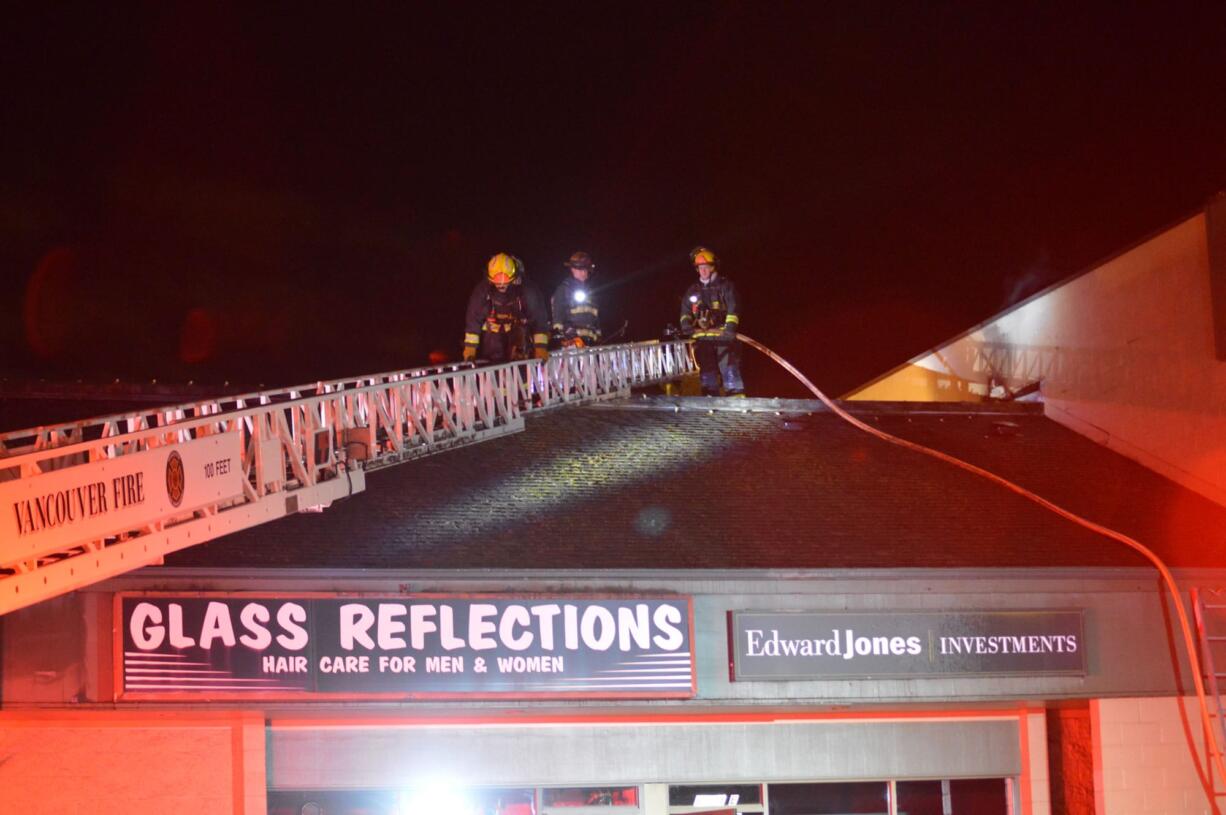 Firefighters respond Friday night to a commercial building fire in Hazel Dell. No one was hurt, and there was no apparent internal damage to the structure, at 6204 N.E. Highway 99.