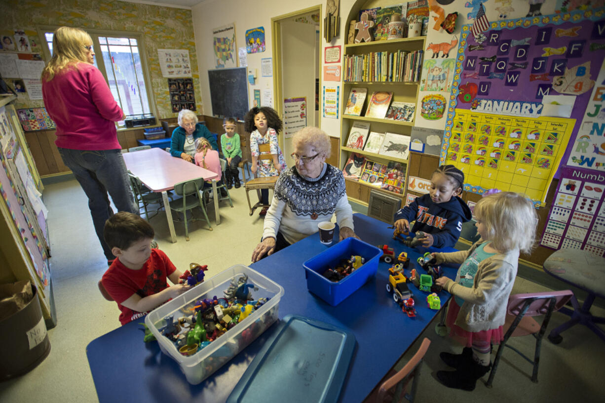 Children&#039;s Day Care Center director Anna Wingate, center, takes part in playtime Jan. 26 at the Gingerbread House. Wingate, 81, retired Jan. 27 after 50 years on the job.