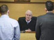 District Court Judge James Swanger presides over the morning arraignment docket Friday in his courtroom at the Clark County Courthouse. Swanger is retiring Tuesday after 18 years on the bench.