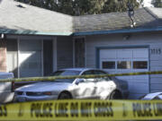 Police tape surrounds a house on East 18th Street in Vancouver on Friday. Vancouver police say a SWAT team found a dead person inside after patrol officers responded to a welfare check call.